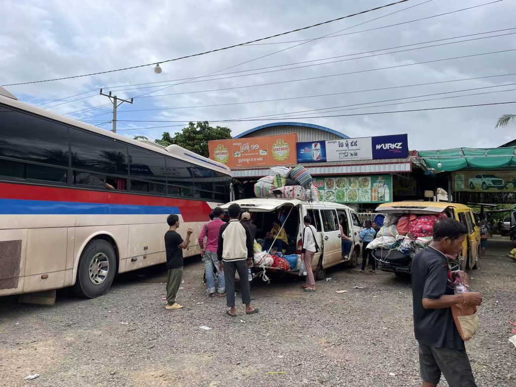 Travelers and buses stopping along National Highway 6 Cambodia
